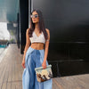 PLEATED DENIM PANTS PAIRED WITH ZARI DENIM BUSTIER